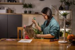 mom combing daughter's hair