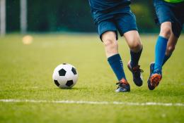 two young men playing football