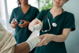nurse dressing patients wound