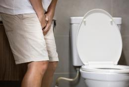 man standing in the washroom