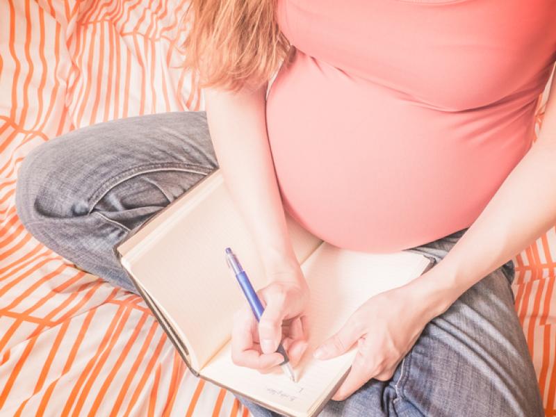 Pregnant Women Writing Down a Birth Plan