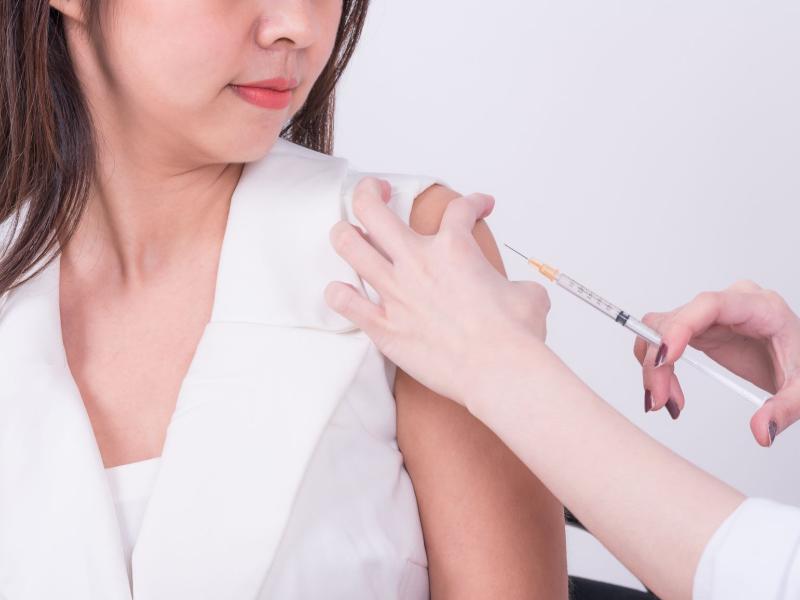 A young person getting a vaccine