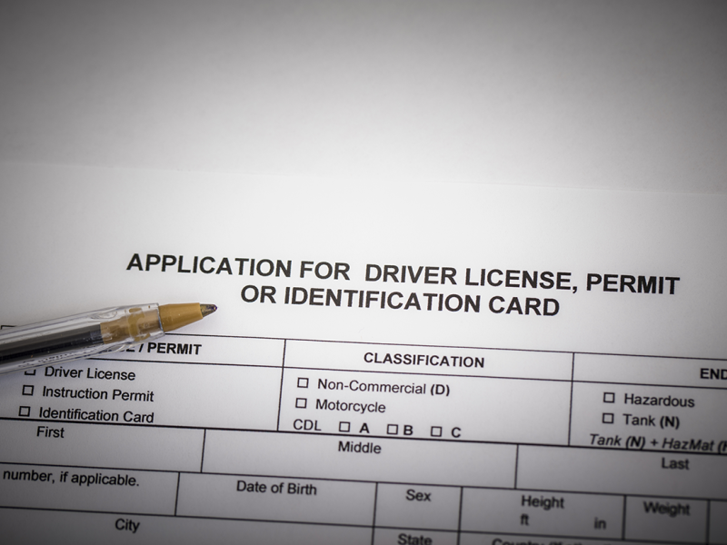 A stock photo showing an Application. for a Drivers License, permit or Identification card.