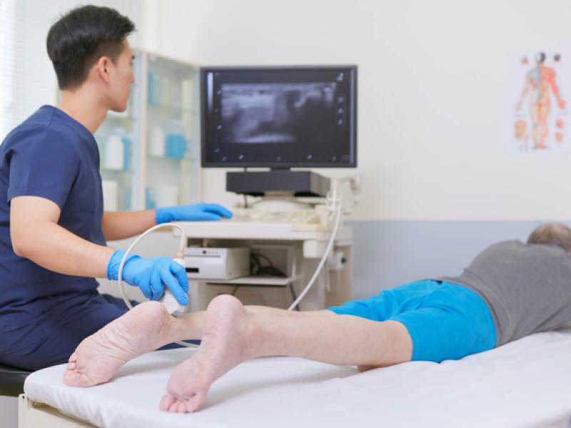 Doctor doing Angiogram on legs