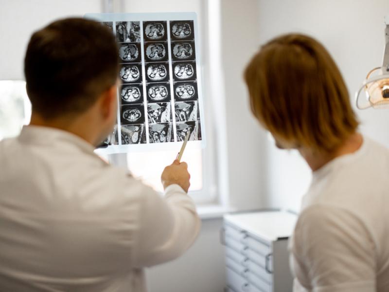 Doctor showing kidney x-ray to patient