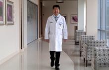Dr. Shieh walking down a hallway