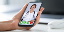 virtual visit on smartphone with female doctor