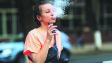 Younger girl with a vape pen