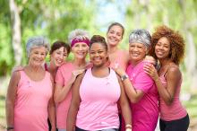 Group of diverse women in pink workout clothes