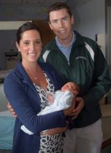 Jessica Brendan with her Husband and newborn.