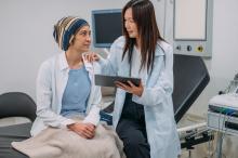 Asian female gynecologist talking to her patient about cervical cancer awareness