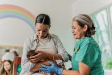 New mother with baby and lactation consultant