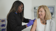 Nursing giving flu shot to the patient