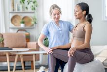 Pregnant woman training with physical therapist