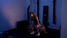 Young girl lifting weight