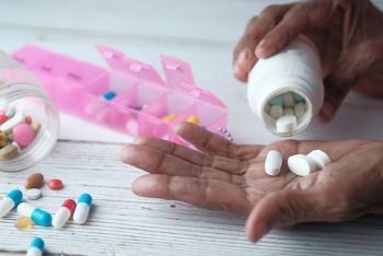 Pills and a pill bottle and a pill organizer