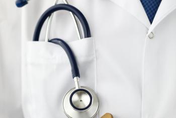 Male GP pocket with stethoscope lying in it holding clipboard close-up