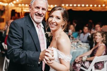 Chuck Pellegrini dancing with his youngest daughter, Melissa.