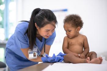 baby receiving immunizations from doctor