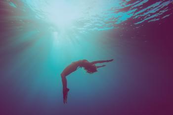 underwater shot of person floating