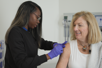 Nursing giving flu shot to the patient