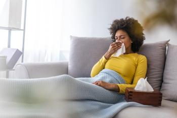 woman sitting on couch