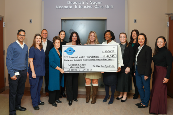 Group picture with donation check