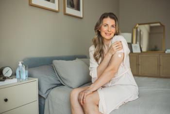 woman with patch on her left arm