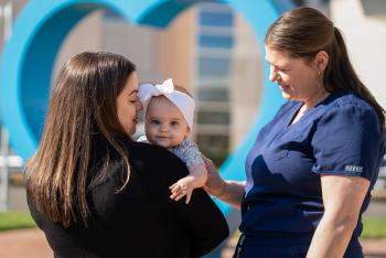 Rachel and her labor and delivery nurse and her baby