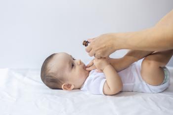 infant baby drinking medicine