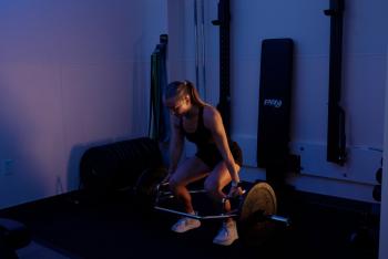 Young girl lifting weight